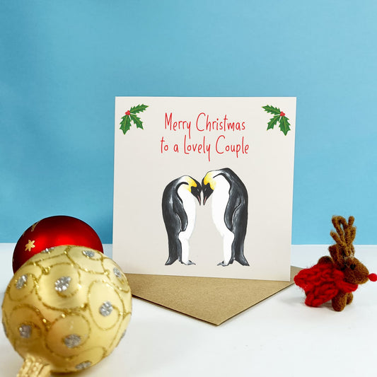 Penguin couple Christmas card to a lovely couple